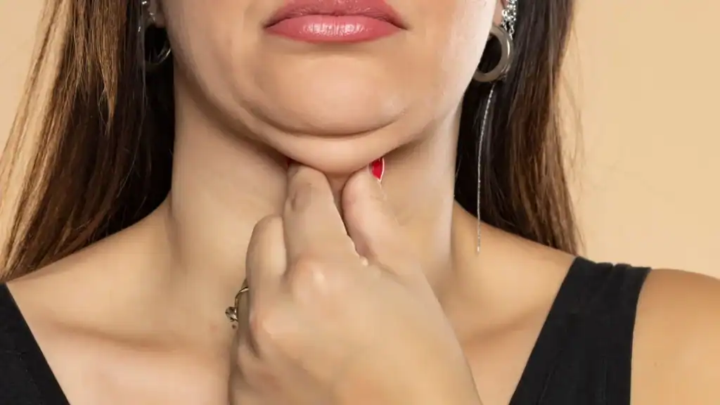 An image of a woman with double chin, sad, worried : Non Surgical Double Chin Removal Treatment in Moss Side, UK